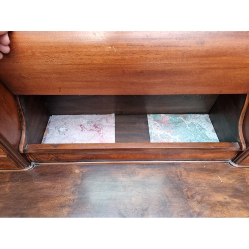 1013 - A Victorian figured walnut Duchess dressing table, 120cm wide.