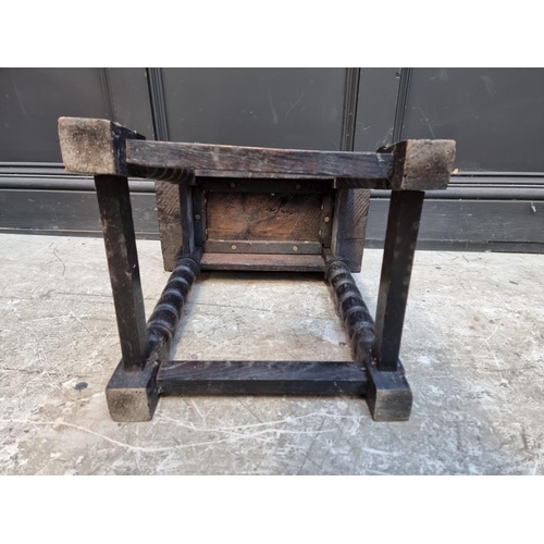 1014 - An oak joint stool, 46cm wide.