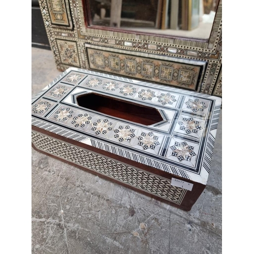 1017 - A Moorish mother-of-pearl inlaid octagonal occasional table, 40cm wide; together with a similar wall... 