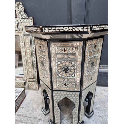 1017 - A Moorish mother-of-pearl inlaid octagonal occasional table, 40cm wide; together with a similar wall... 