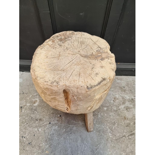 1026 - An unusual butcher's block style tree trunk tripod table, 65cm high x 65cm wide.