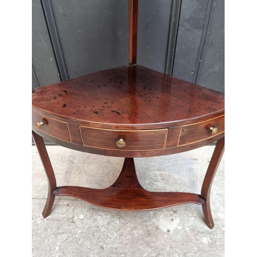 1029 - A George III mahogany and line inlaid corner washstand, 99cm high, (alterations).