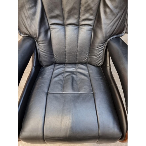 1032 - A Himolla Mosel Maxi black leather electric recliner armchair.
