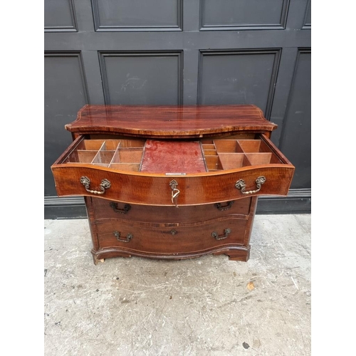 1039 - A George III mahogany serpentine chest, the top drawer partially fitted with pigeon holes, 107cm wid... 