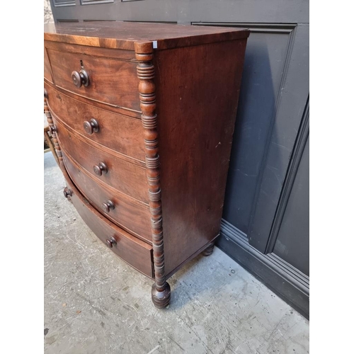 1041 - An early Victorian mahogany bowfront chest of drawers, with turned pilasters, 118cm wide.... 