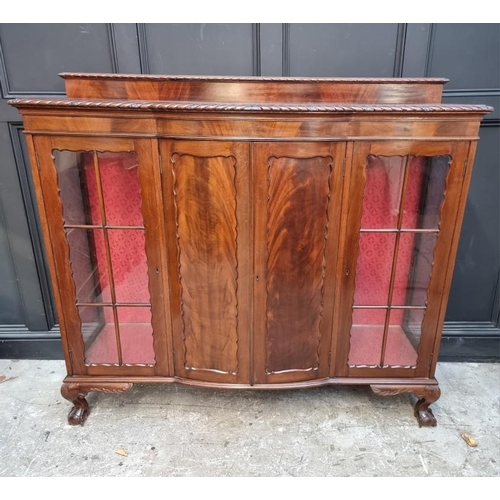 1053 - A 1920s mahogany bowfront side cabinet, 153cm wide.