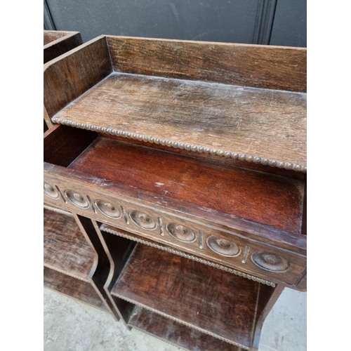 1061 - A small pair of 1920s oak open bookcases, each with frieze drawer, 38cm wide.