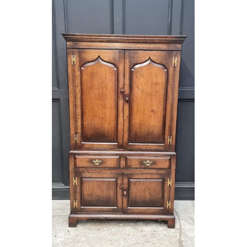 1062 - A good reproduction 'Ipswich' oak press cupboard, 103cm wide.