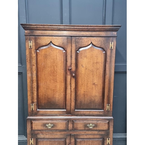 1062 - A good reproduction 'Ipswich' oak press cupboard, 103cm wide.