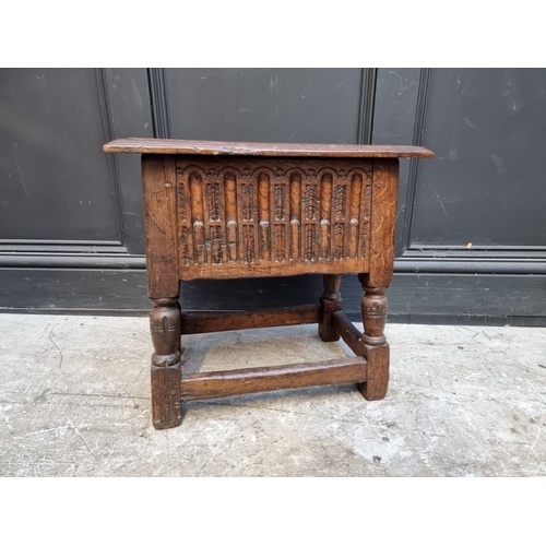 1064 - A 17th century style carved oak box seat joint or close stool, 46cm wide.