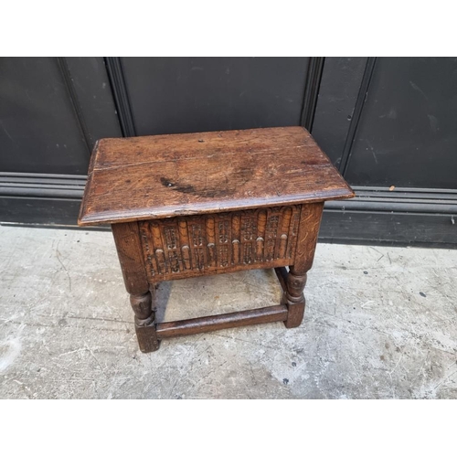 1064 - A 17th century style carved oak box seat joint or close stool, 46cm wide.