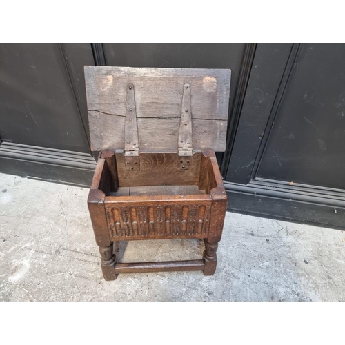 1064 - A 17th century style carved oak box seat joint or close stool, 46cm wide.