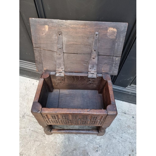 1064 - A 17th century style carved oak box seat joint or close stool, 46cm wide.