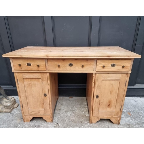 1066 - An antique Continental pine pedestal desk, 120cm wide.  