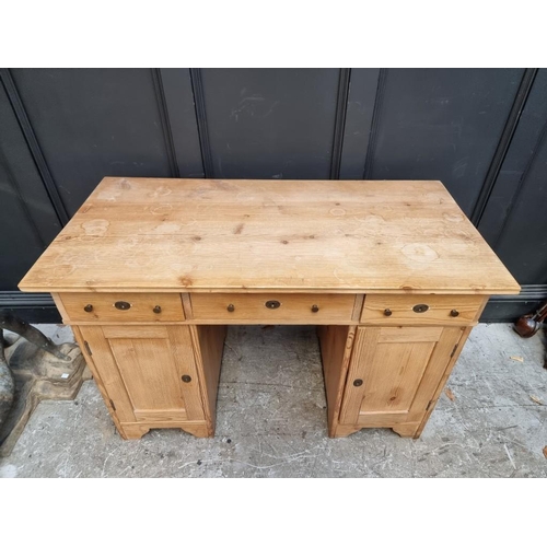 1066 - An antique Continental pine pedestal desk, 120cm wide.  