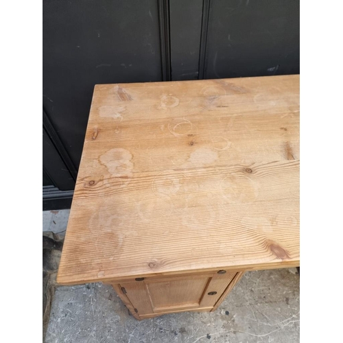 1066 - An antique Continental pine pedestal desk, 120cm wide.  