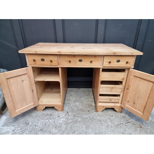 1066 - An antique Continental pine pedestal desk, 120cm wide.  