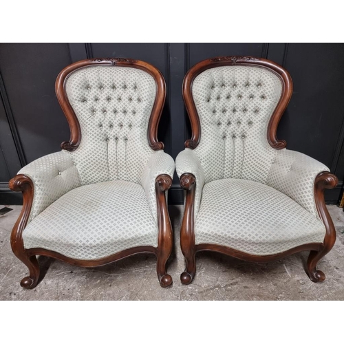 1069 - A pair of Victorian style carved mahogany and button upholstered occasional armchairs; together with... 