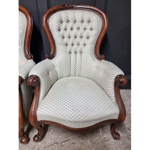 1069 - A pair of Victorian style carved mahogany and button upholstered occasional armchairs; together with... 