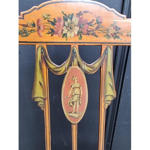 1077 - A pair of antique, Sheraton style, painted satinwood and cane open arm elbow chairs. ... 