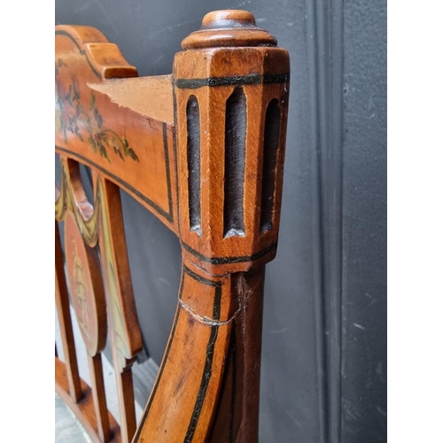 1077 - A pair of antique, Sheraton style, painted satinwood and cane open arm elbow chairs. ... 