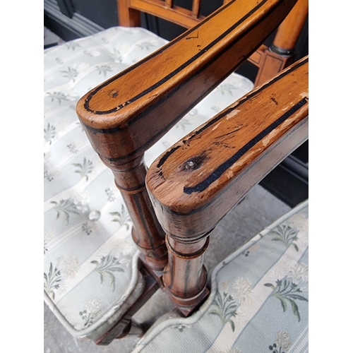 1077 - A pair of antique, Sheraton style, painted satinwood and cane open arm elbow chairs. ... 