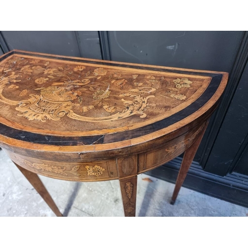 1082 - A late 18th century Dutch walnut and marquetry demi-lune card table, with double gateleg action, 76c... 