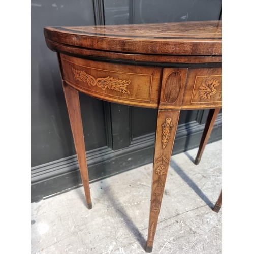 1082 - A late 18th century Dutch walnut and marquetry demi-lune card table, with double gateleg action, 76c... 