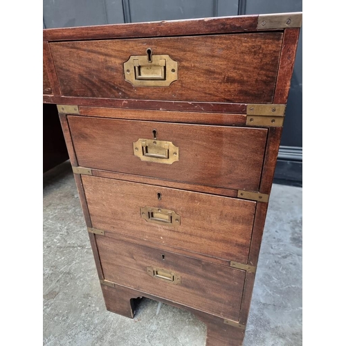 1085 - A large mahogany and brass bound pedestal desk, with countersunk handles, 152.5cm wide. &n... 