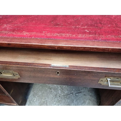 1085 - A large mahogany and brass bound pedestal desk, with countersunk handles, 152.5cm wide. &n... 