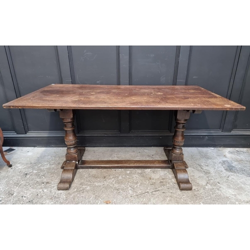 1087 - An oak trestle type table, with cleated five plank top, 152cm long.