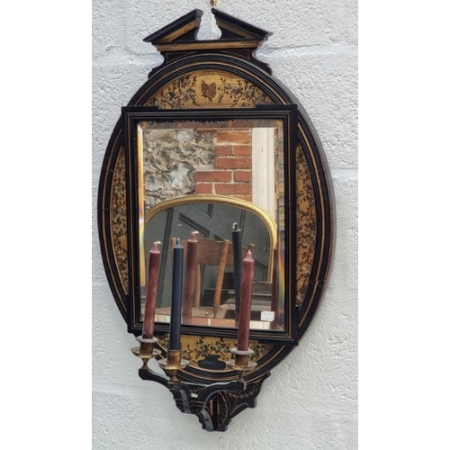 1089 - An Aesthetic ebonized and painted giltwood girandole, 83 x 49cm.