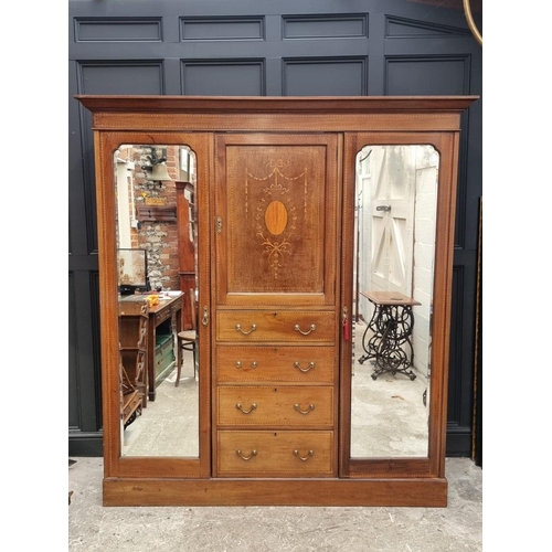 1093 - A late Edwardian mahogany and inlaid triple wardrobe, labelled 'Maple & Co', 190cm wide.... 