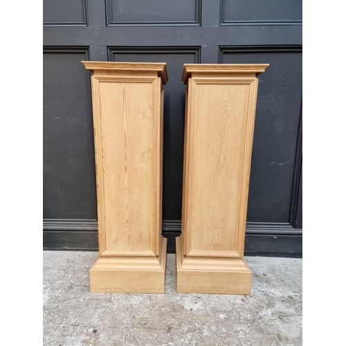 1099 - A pair of pine pedestals, 102cm high x 33.5cm wide.