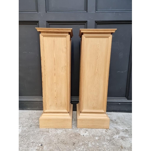 1099 - A pair of pine pedestals, 102cm high x 33.5cm wide.