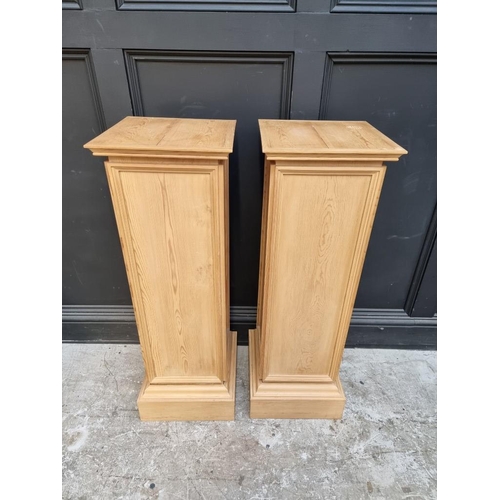 1099 - A pair of pine pedestals, 102cm high x 33.5cm wide.