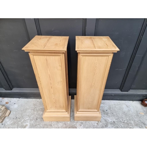 1099 - A pair of pine pedestals, 102cm high x 33.5cm wide.