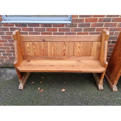 1103 - A pair of Victorian pitch pine pews, 144cm wide.