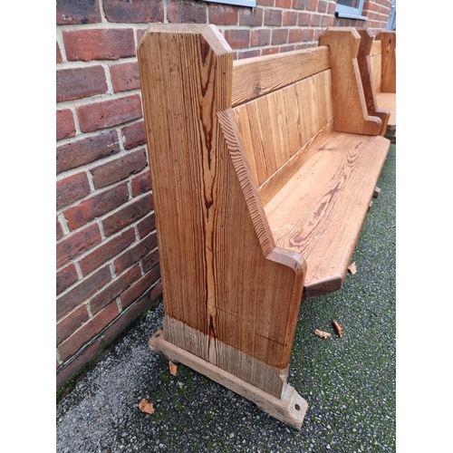 1103 - A pair of Victorian pitch pine pews, 144cm wide.