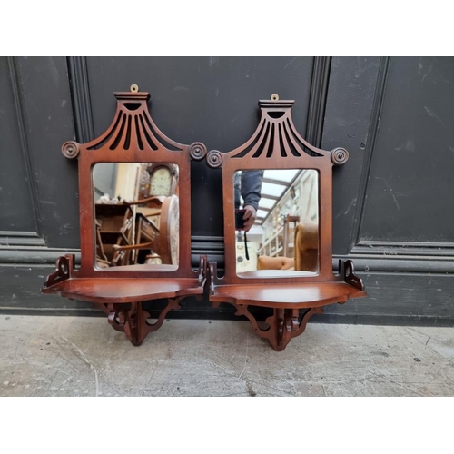 1109 - A small pair of mahogany mirror back hanging shelves, 52.5 x 29cm.