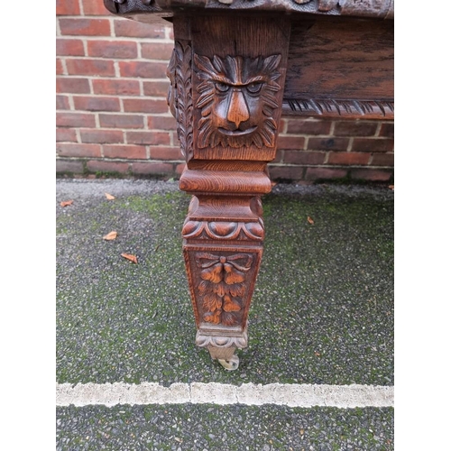 1111 - A Victorian carved oak extending dining table, with two leaf insertions, 235cm extended.... 