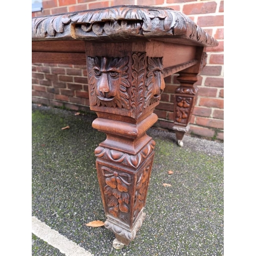 1111 - A Victorian carved oak extending dining table, with two leaf insertions, 235cm extended.... 