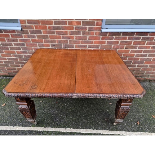 1111 - A Victorian carved oak extending dining table, with two leaf insertions, 235cm extended.... 