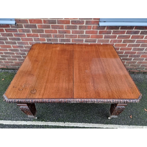 1111 - A Victorian carved oak extending dining table, with two leaf insertions, 235cm extended.... 