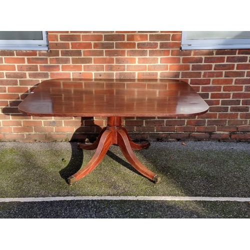 1112 - A 19th century mahogany and line inlaid tilt-top breakfast table, 143cm wide.