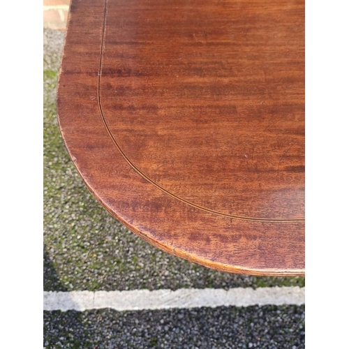 1112 - A 19th century mahogany and line inlaid tilt-top breakfast table, 143cm wide.