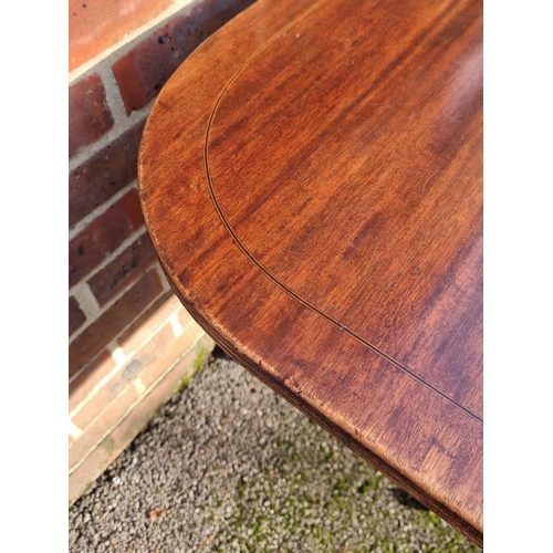 1112 - A 19th century mahogany and line inlaid tilt-top breakfast table, 143cm wide.