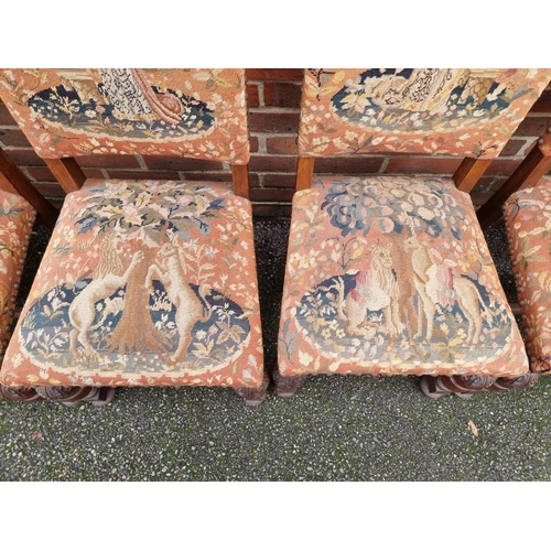 1117 - A set of eight 17th century style carved oak and tapestry upholstered dining chairs.... 