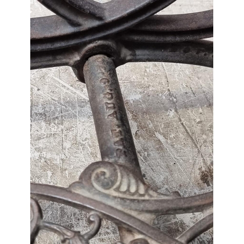 1134 - A late 19th century Willcox & Gibbs cast iron sewing machine base, 63cm wide.... 