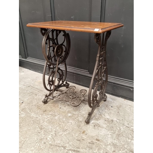 1134 - A late 19th century Willcox & Gibbs cast iron sewing machine base, 63cm wide.... 